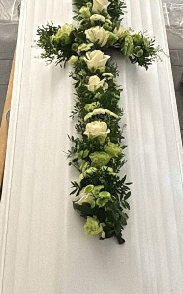 Cross funeral arrangement